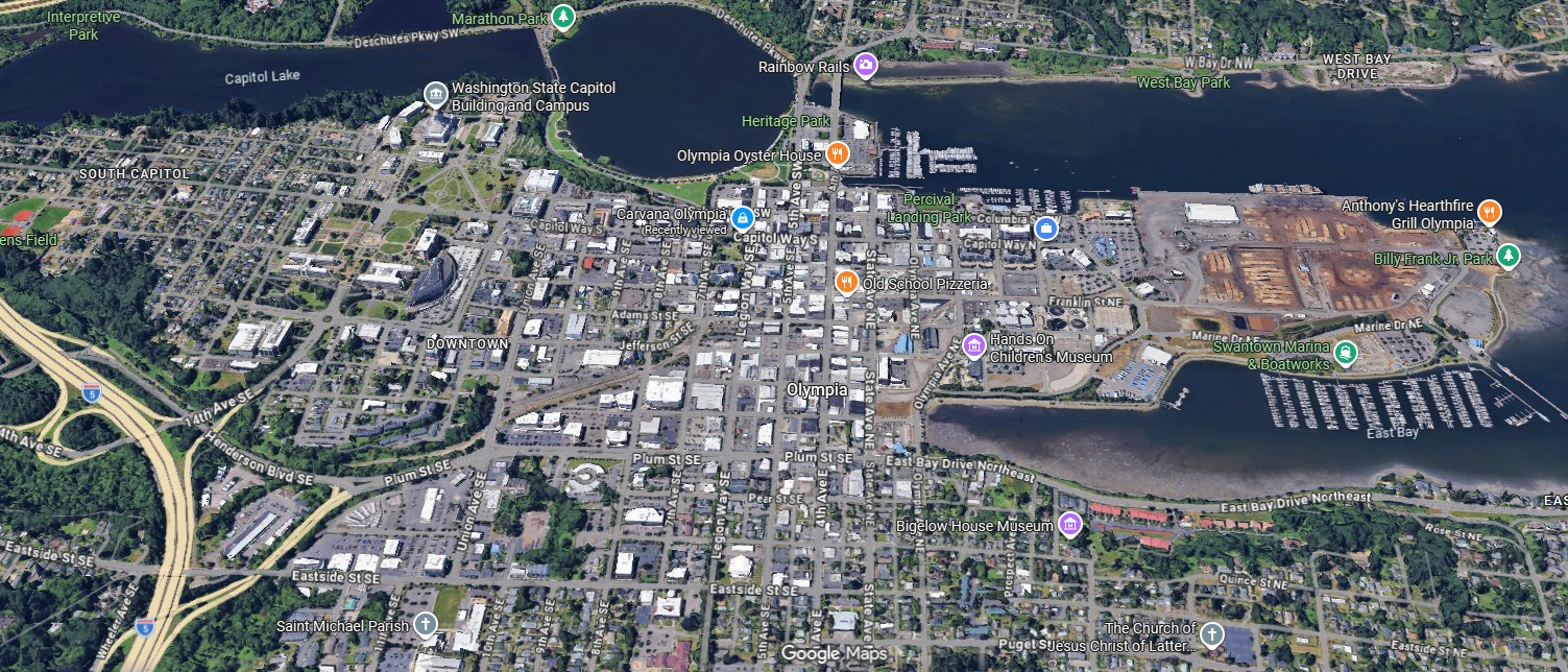 Aerial view of downtown Olympia, Budd Inlet and the Port of Olympia Marine Terminal with I-5 at left